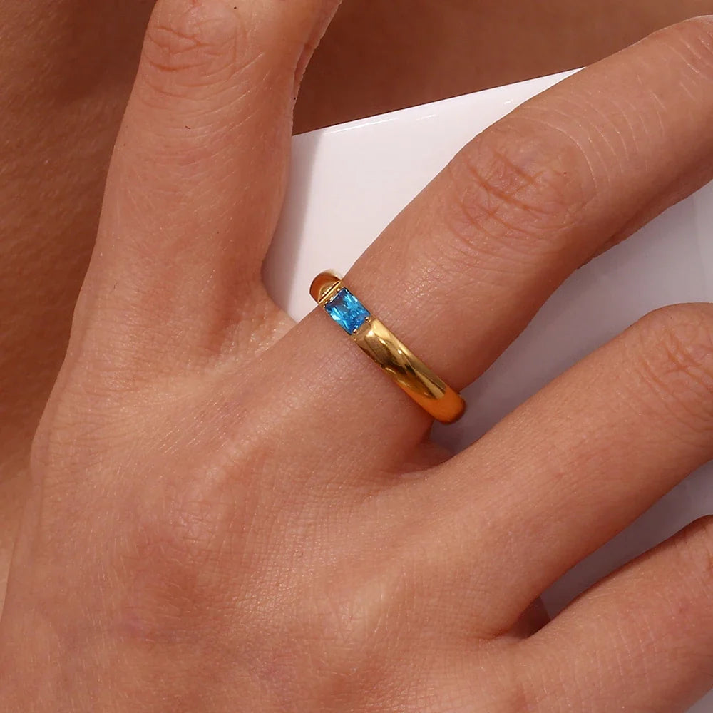 Women’s birthstone ring, bezel-set, December