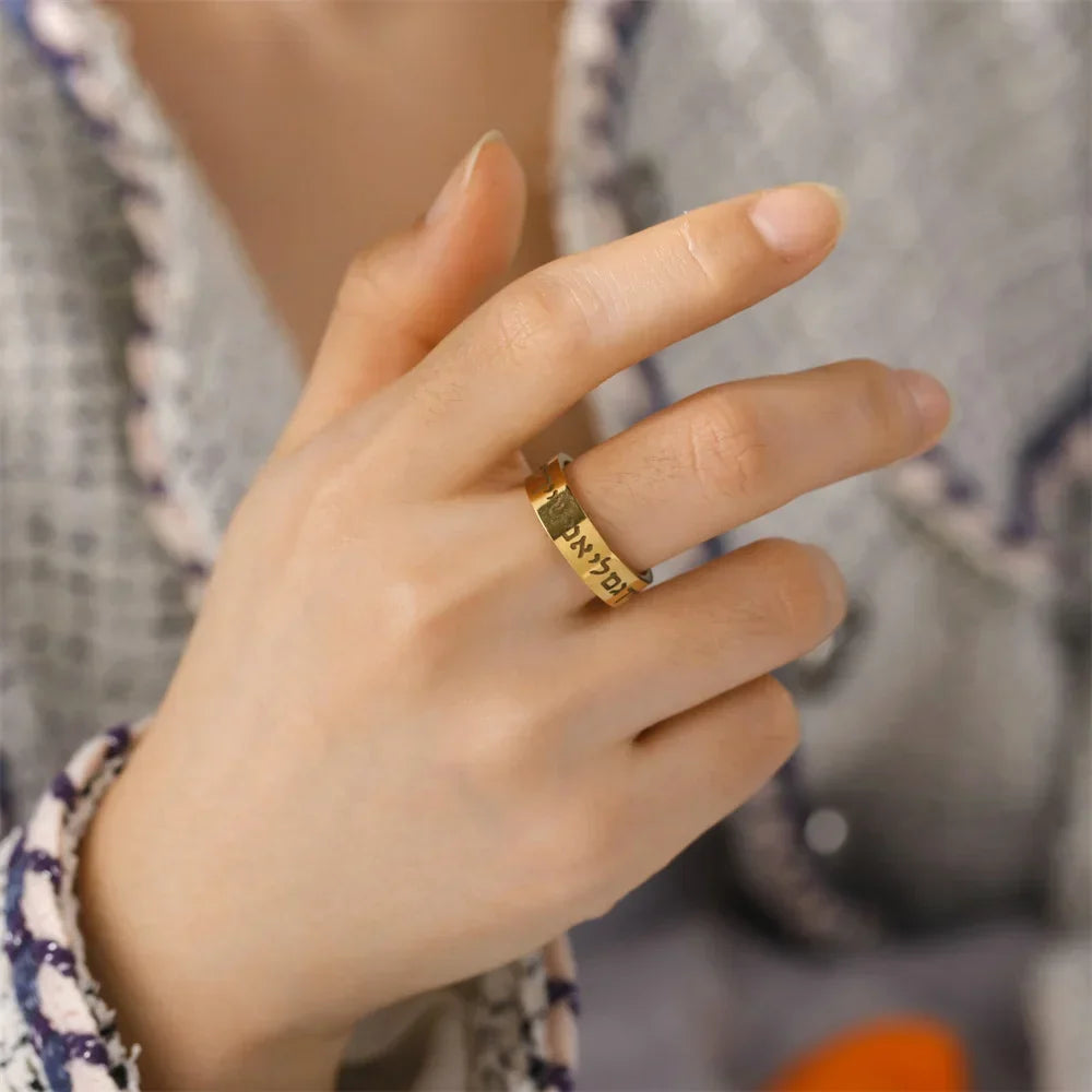 Wide ring with Jewish Hebrew letters in gold