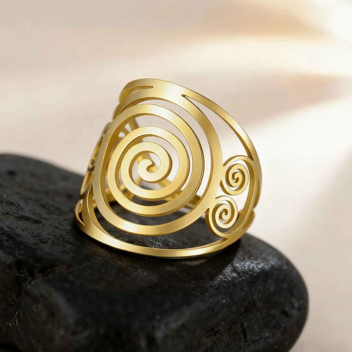Wide spiral ring for women in gold