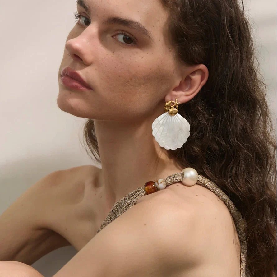 Shell pearl-colored earrings and starfish