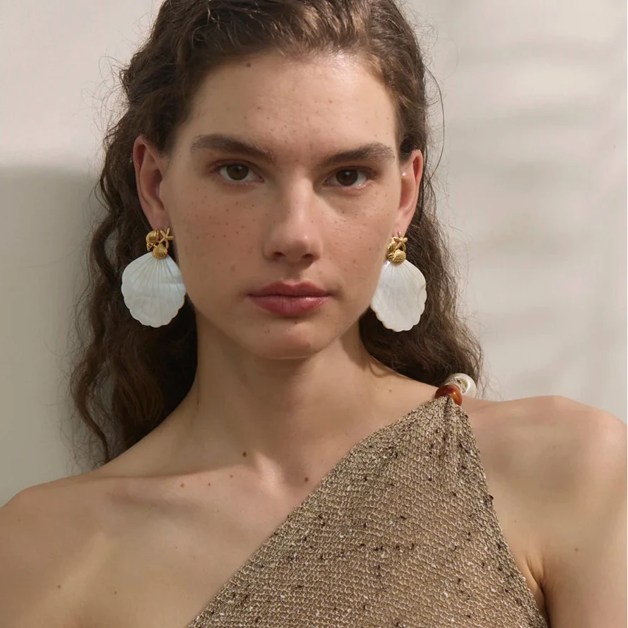 Shell pearl-colored earrings and starfish