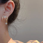 Boucles d'oreilles griffes scintillantes pour femme
