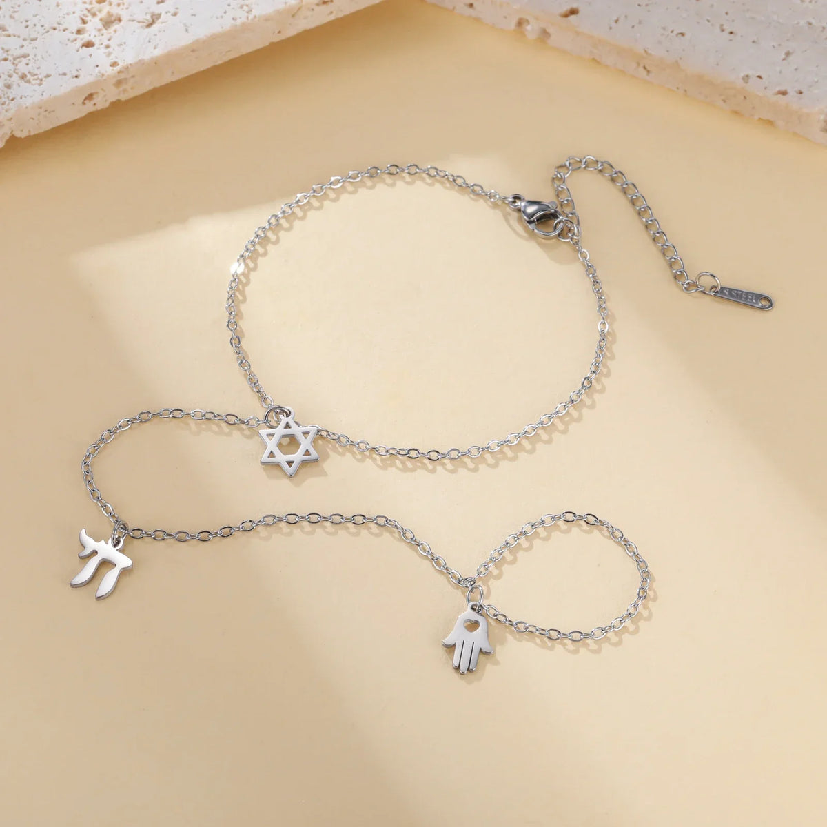 Hand and finger bracelet with Jewish protective pendants Chai, Star of David and Hamsa star silver