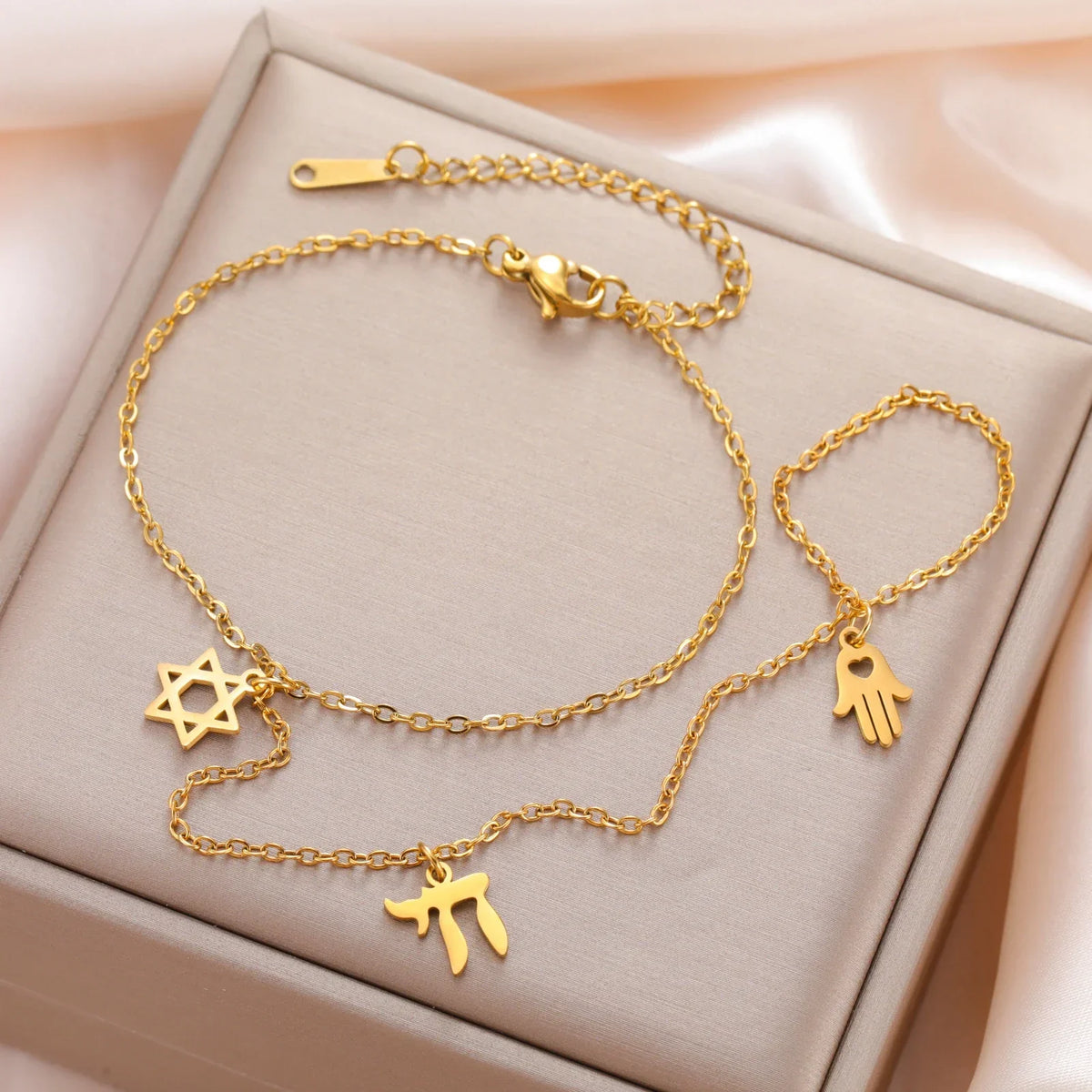 Hand and finger bracelet with Jewish protective pendants Chai, Star of David and Hamsa star gold