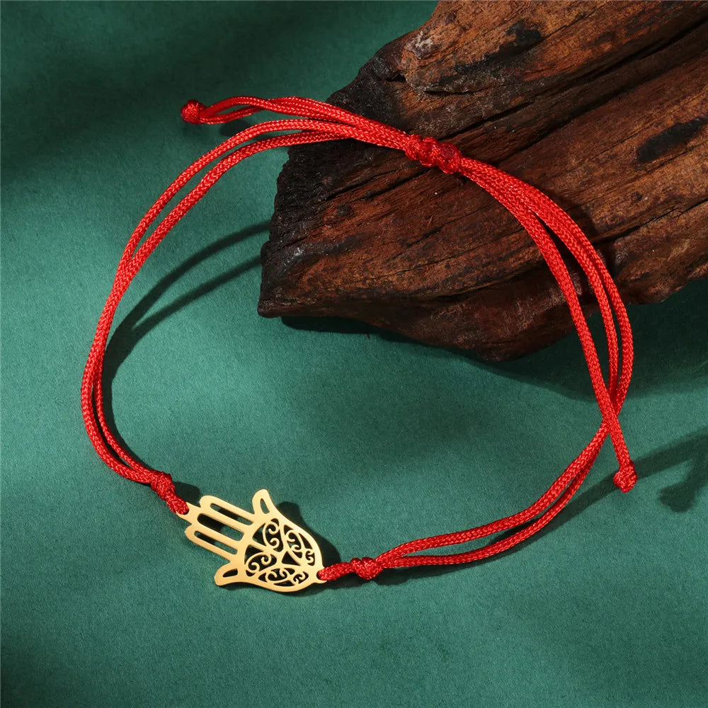 Cord bracelet with Arabic Hand of Fatima in gold
