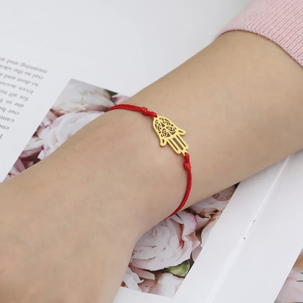 Cord bracelet with Arabic Hand of Fatima in gold