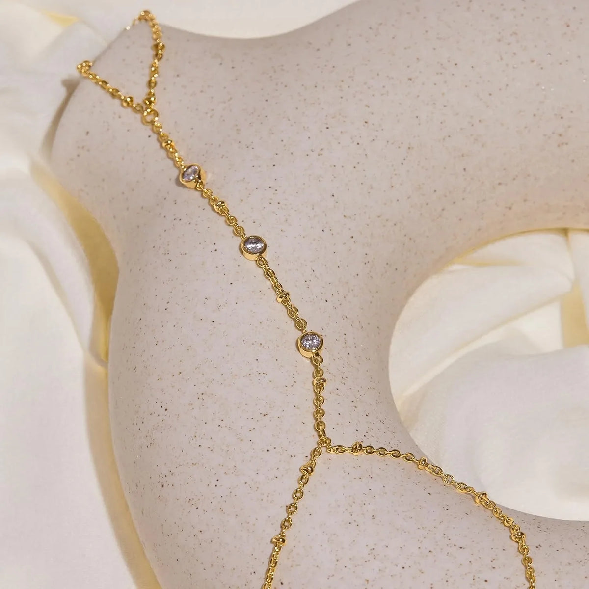 Hand and finger chain with cubic zirconia - women’s hand bracelet gold