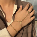 Heart hand and finger chain - women’s hand chain in gold