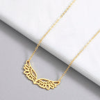 Necklace with large gold angel wings pendant