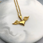 Necklace with angel wing and heart pendant