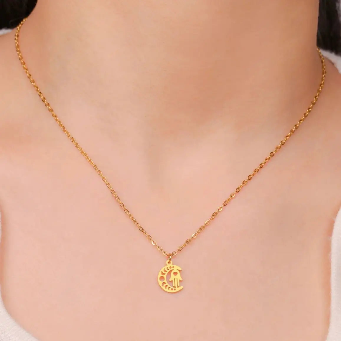 Necklace with Arabic Islamic crescent moon and Hamsa pendant in gold