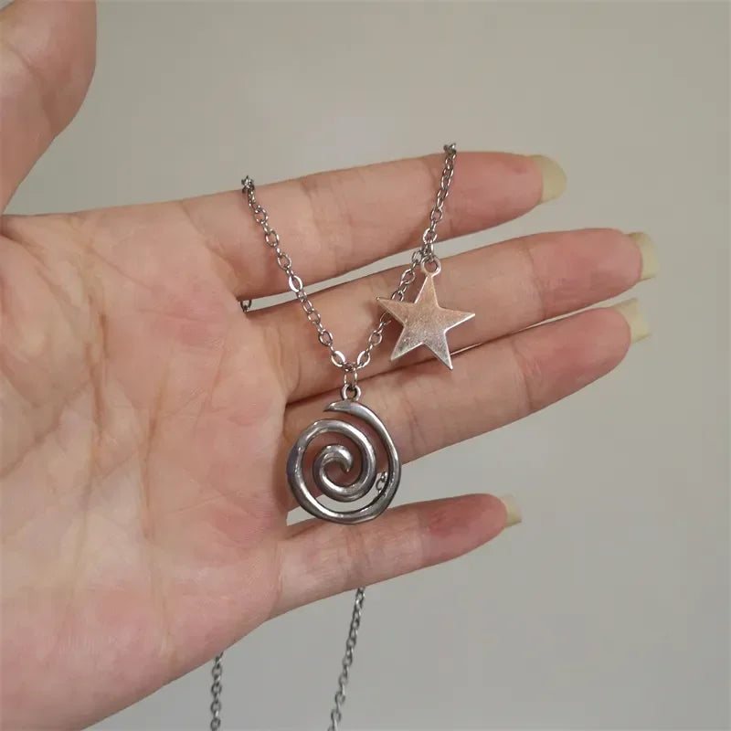 Necklace with spiral pendant and small star