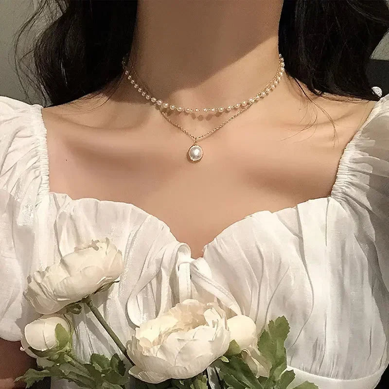 Элегантное двойное колье с подвеской из жемчужины, золото