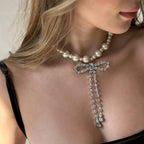 Choker necklace with rhinestone bow pendant
