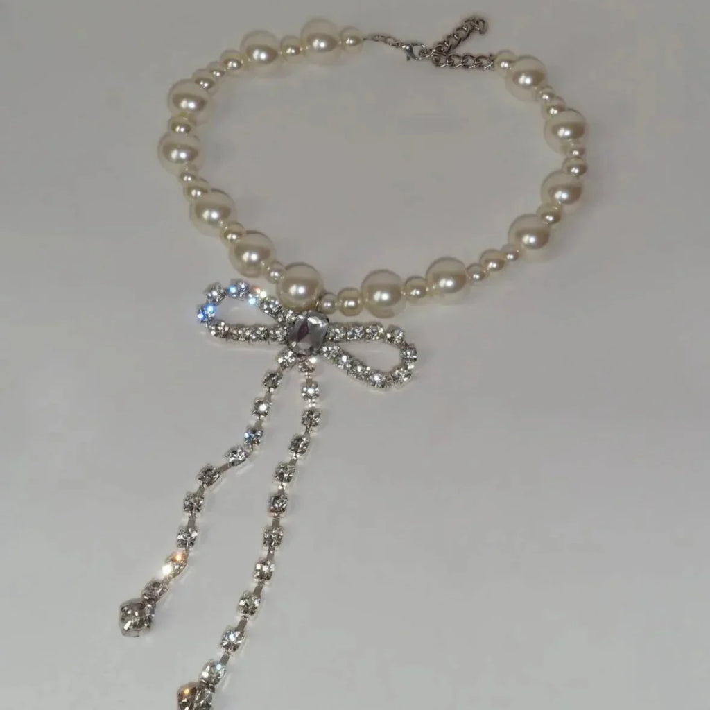 Choker necklace with rhinestone bow pendant
