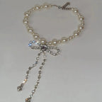 Choker necklace with rhinestone bow pendant