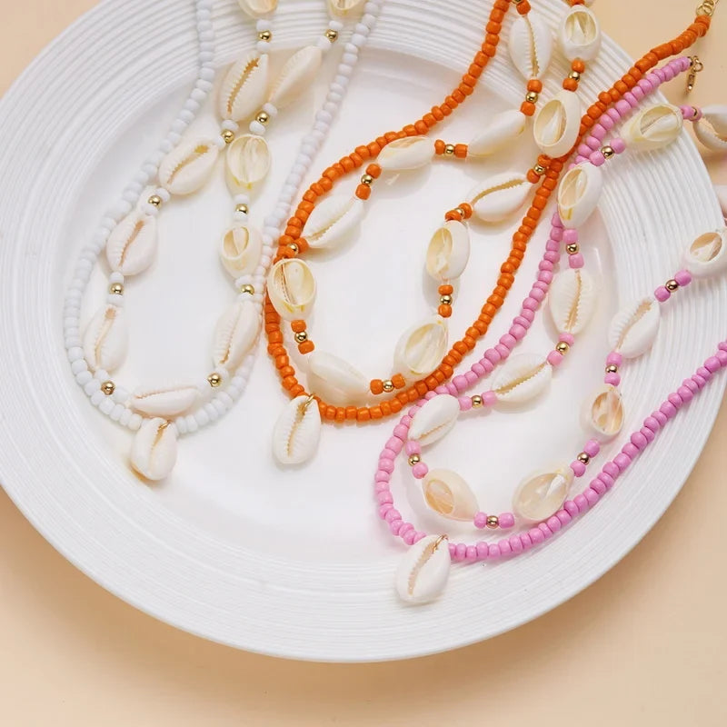 Double cowrie shell necklace, red