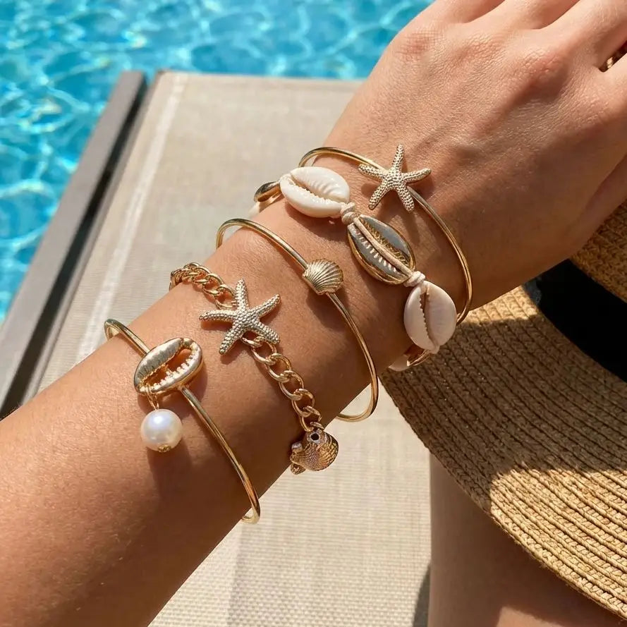 Set of 5 gold shell and star bracelets
