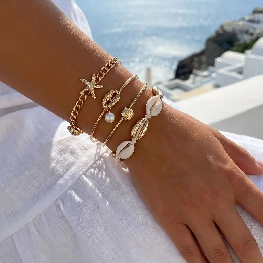 Set of 5 gold shell and star bracelets