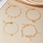 Set of 5 anklets: star, infinity, butterfly, beads, and heart